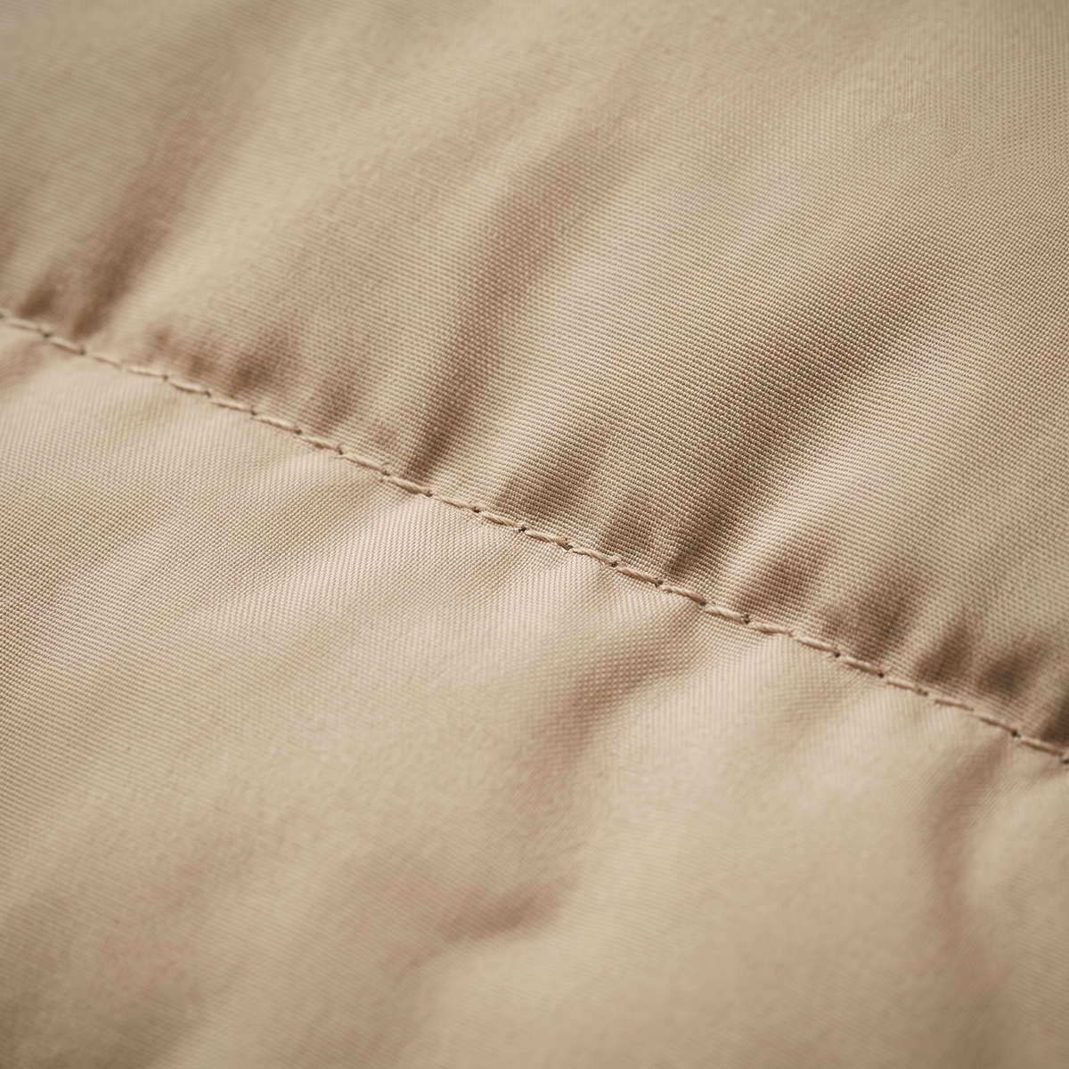 Sand beige quilted nylon fabric macro